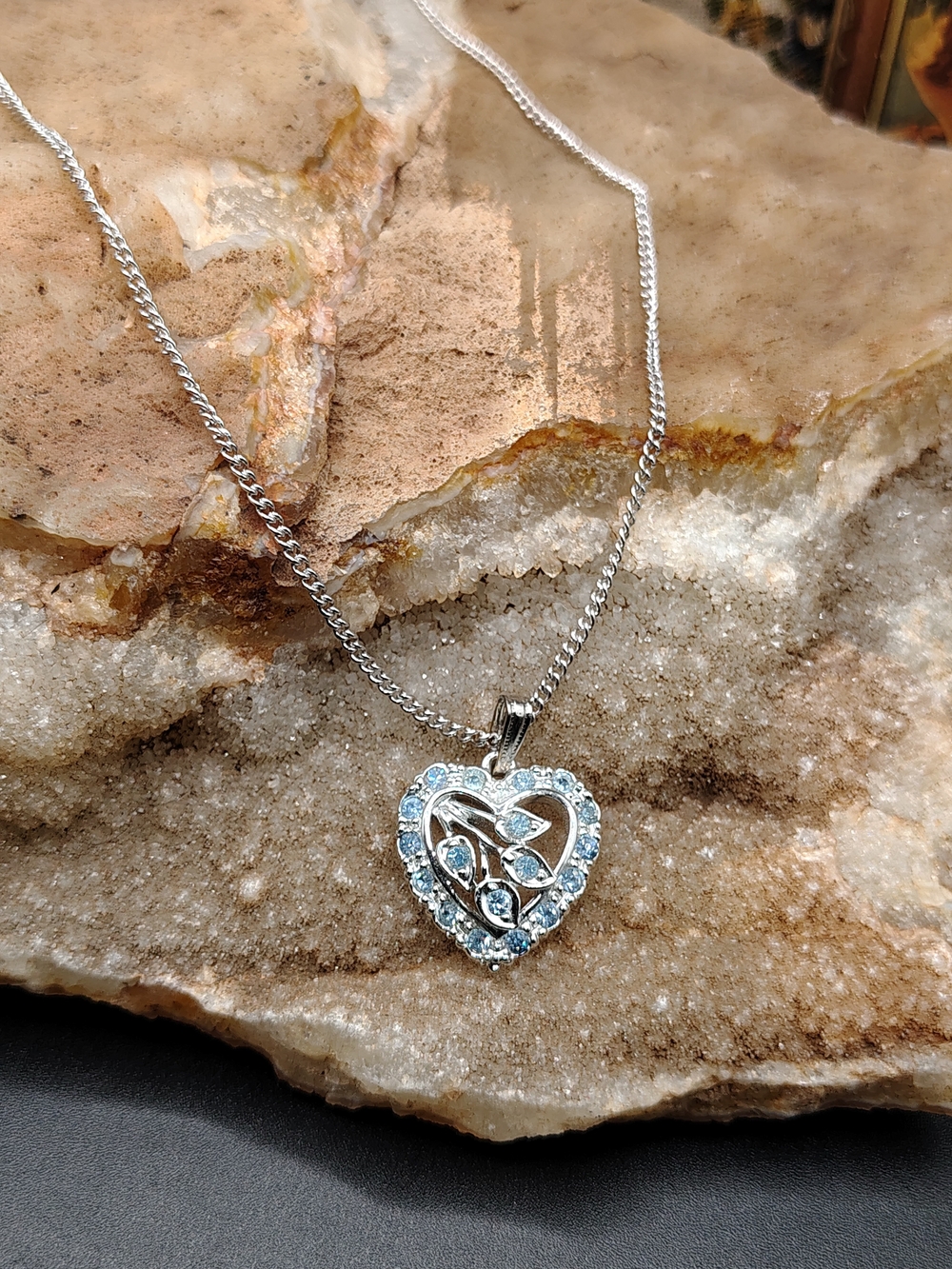 Silver Tone Heart Pendant Necklace with Light Blue Rhinestones.
